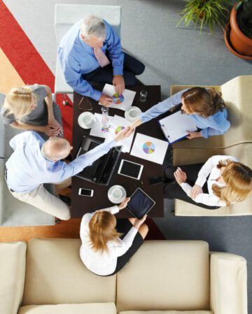 Two people shaking hands at a business meeting